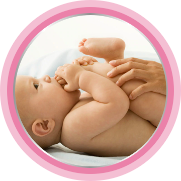 Baby laying on bed after application Bepanthen cream.